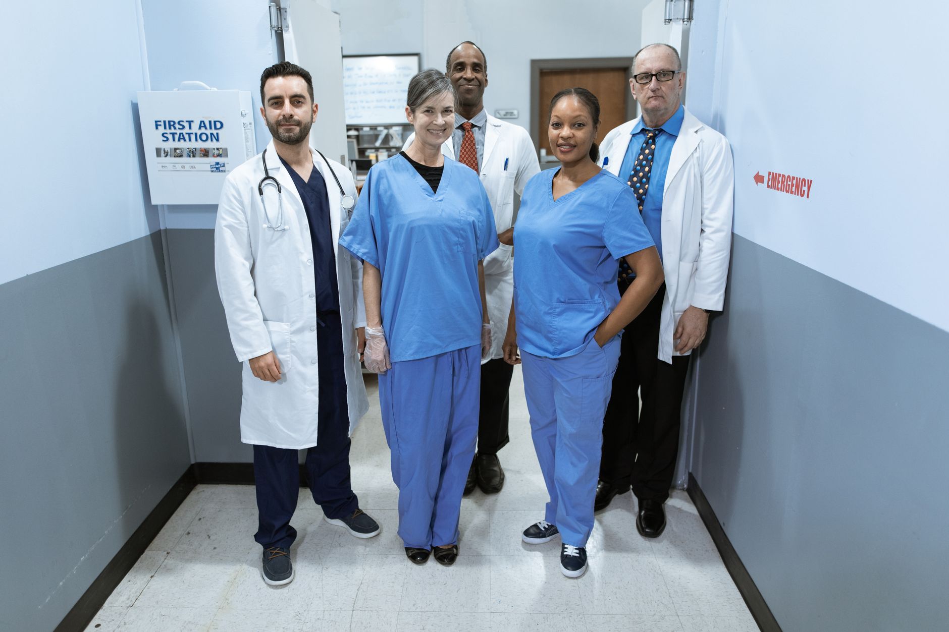 Orthopedic surgeons walking through a hospital corridor in scrubs
