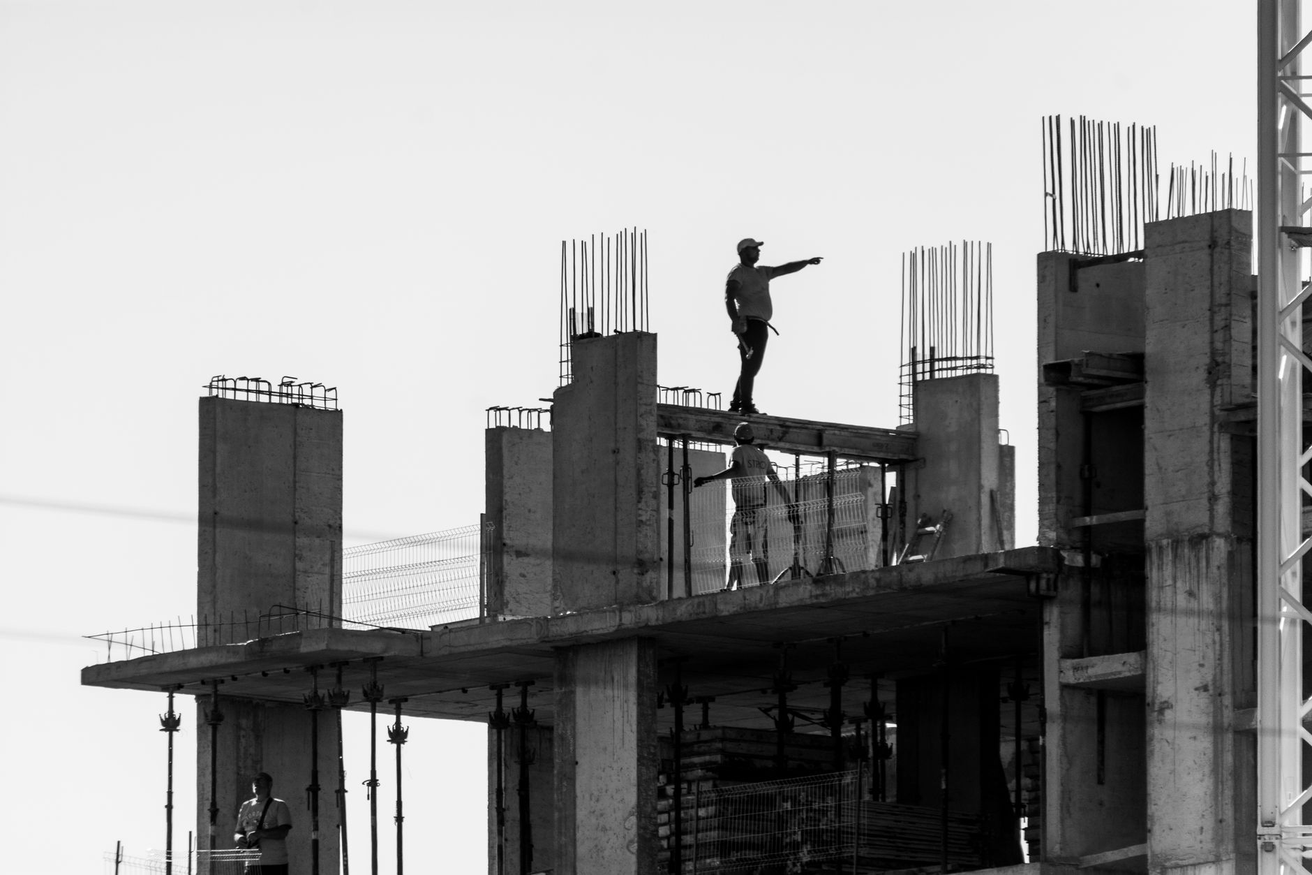 Skilled tradespeople working on a large commercial construction project