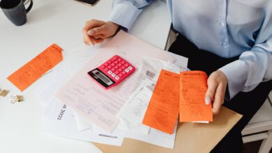 Medical billing professional working at a desk in a healthcare administrative office