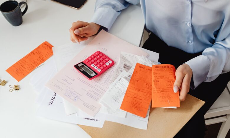 Medical billing professional working at a desk in a healthcare administrative office