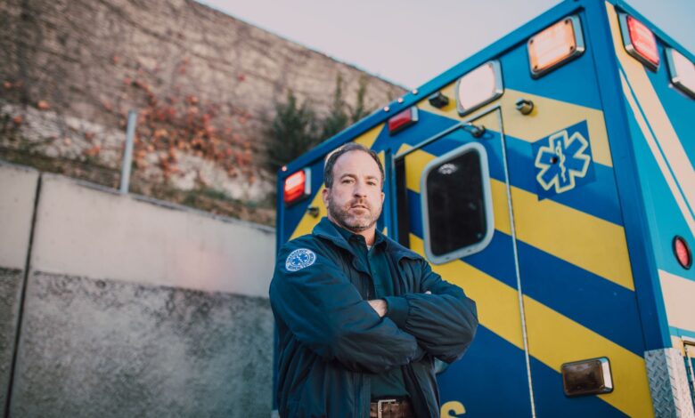 An ambulance driving through a city street on an emergency call