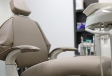 Interior of a modern medical clinic waiting room with seating and reception desk