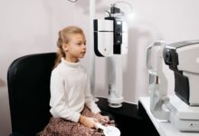 Optometrist conducting an eye examination in a modern clinic setting