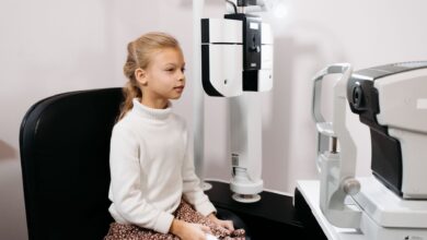 Optometrist conducting an eye examination in a modern clinic setting