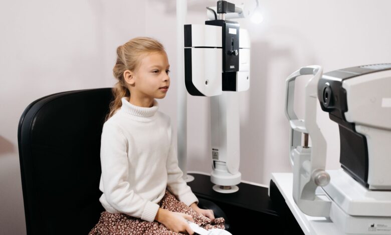 Optometrist conducting an eye examination in a modern clinic setting