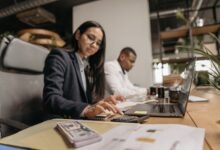 Accountants working at desks in a professional office setting