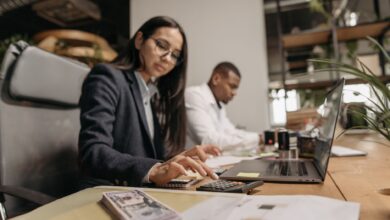 Accountants working at desks in a professional office setting