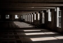 Multi-level parking garage interior with rows of empty parking spaces