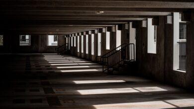 Multi-level parking garage interior with rows of empty parking spaces