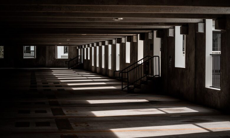 Multi-level parking garage interior with rows of empty parking spaces