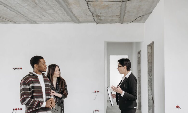 Home inspector examining a residential property exterior during a professional inspection