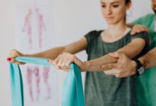Physical therapist working with a patient in a modern outpatient clinic
