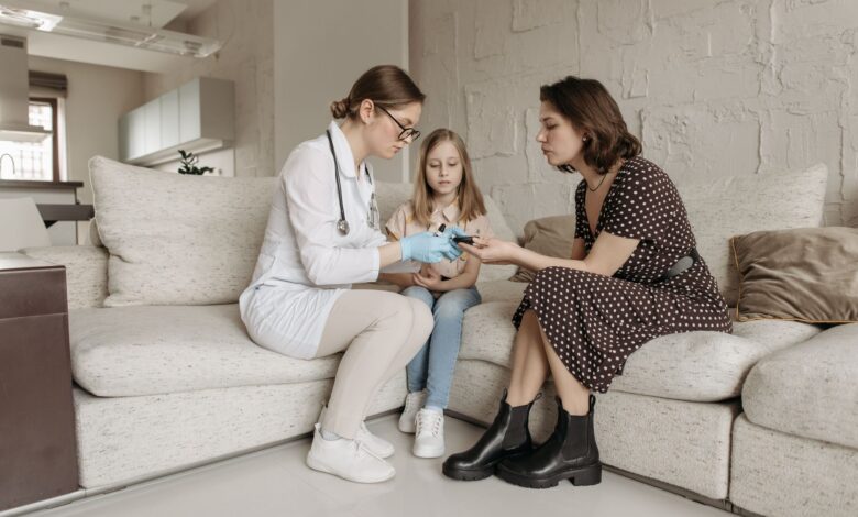 A home health aide assisting an elderly patient in a residential setting