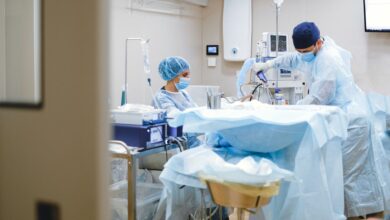 Orthopedic surgeon reviewing patient charts in a clinical setting