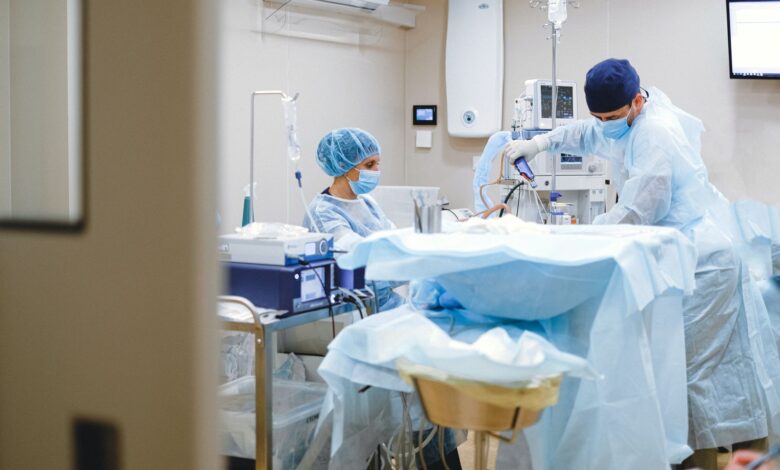 Orthopedic surgeon reviewing patient charts in a clinical setting