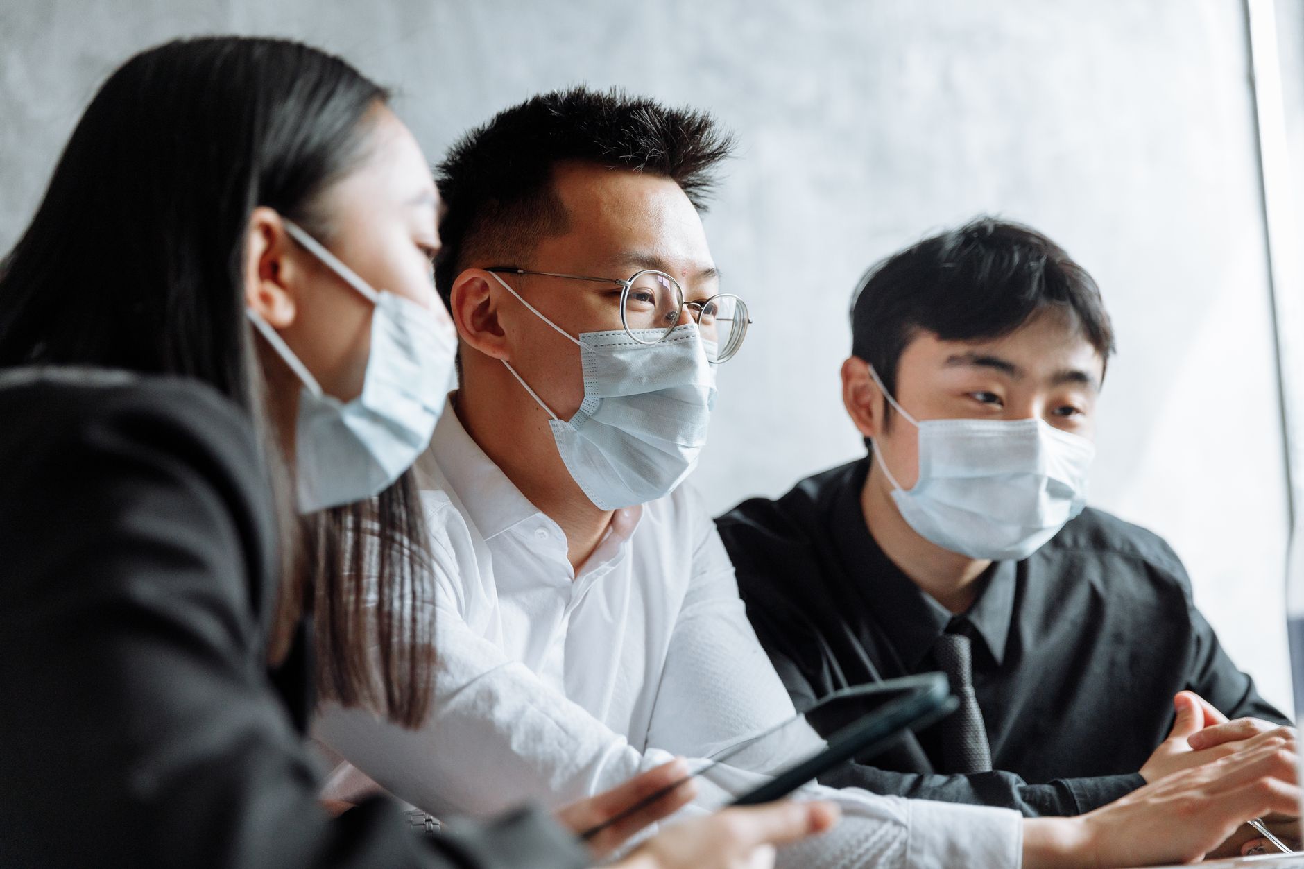 Business professionals in a meeting discussing healthcare operations and contracts