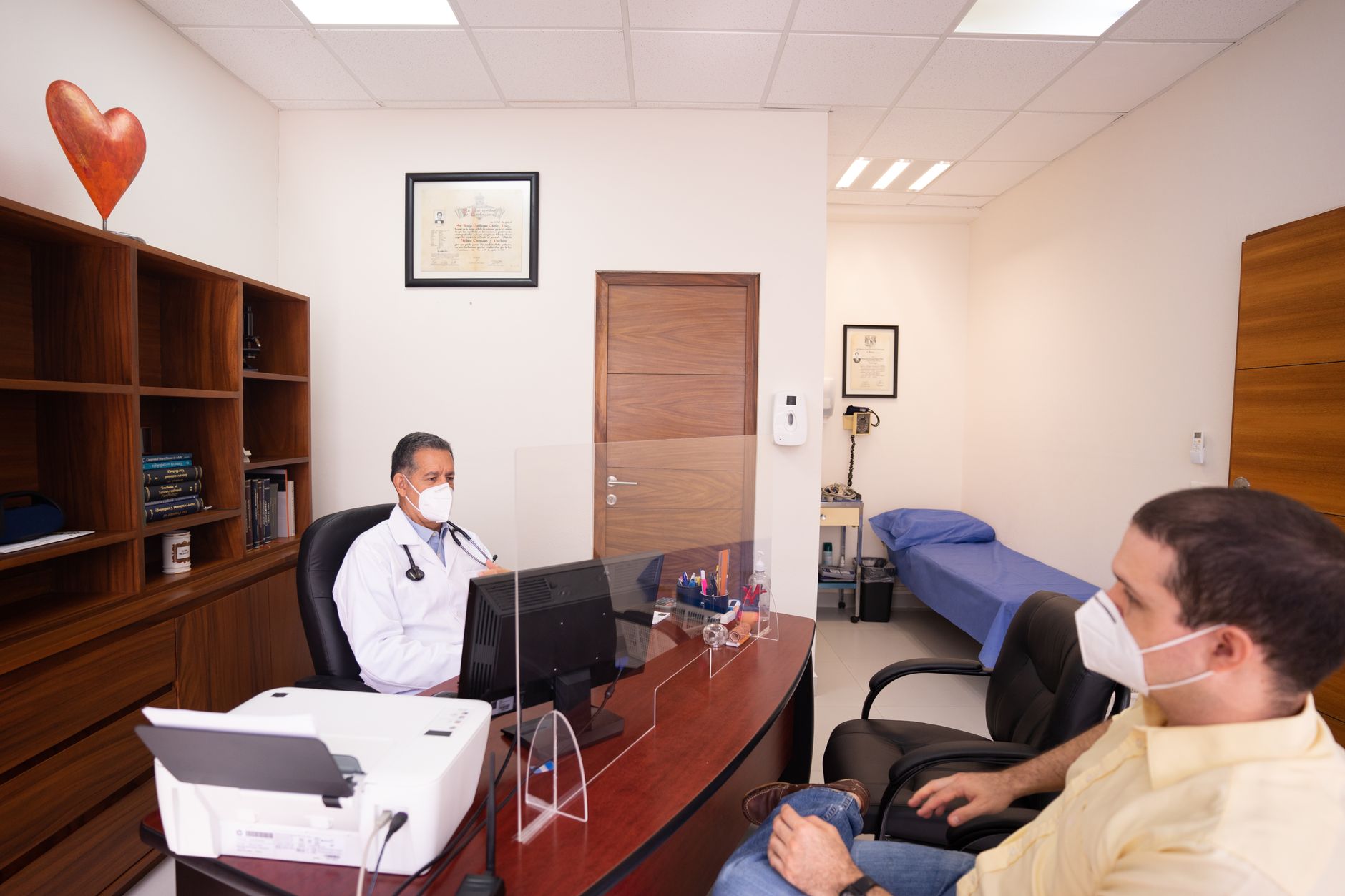 Cardiologist consulting with a patient in a private practice office
