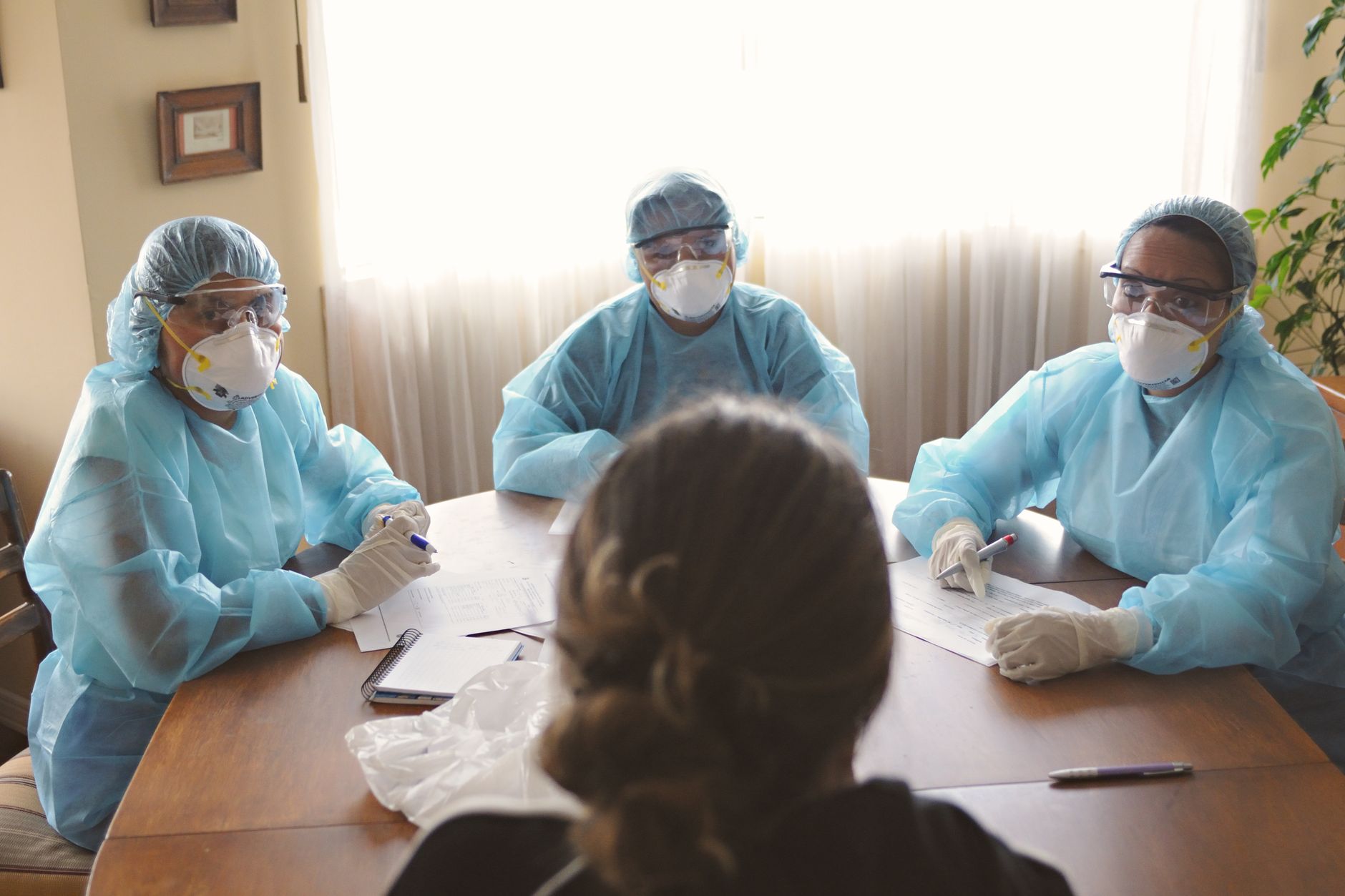 Healthcare executives reviewing documents at a conference table