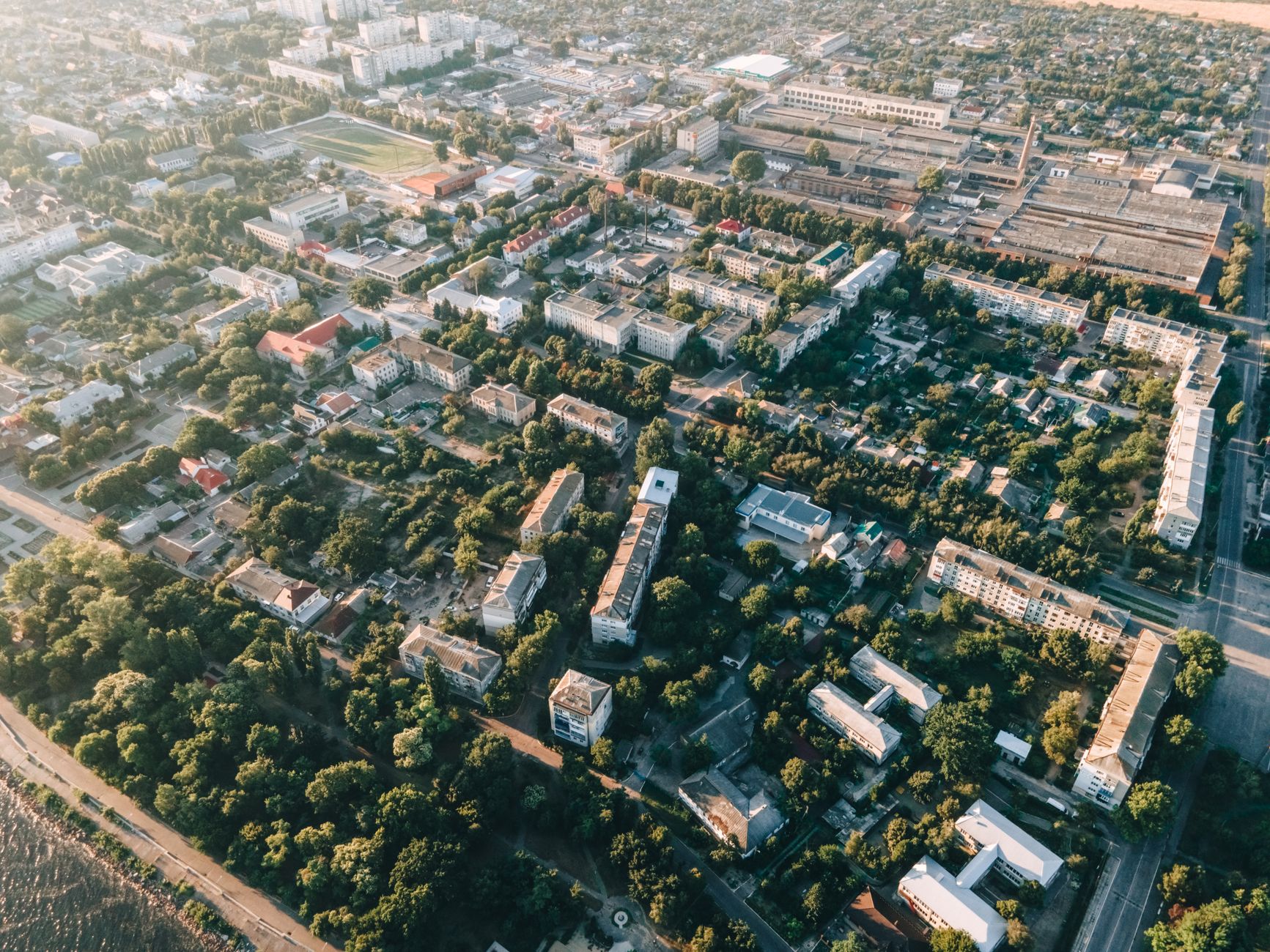 Aerial view of a dense residential suburban neighborhood with rows of houses