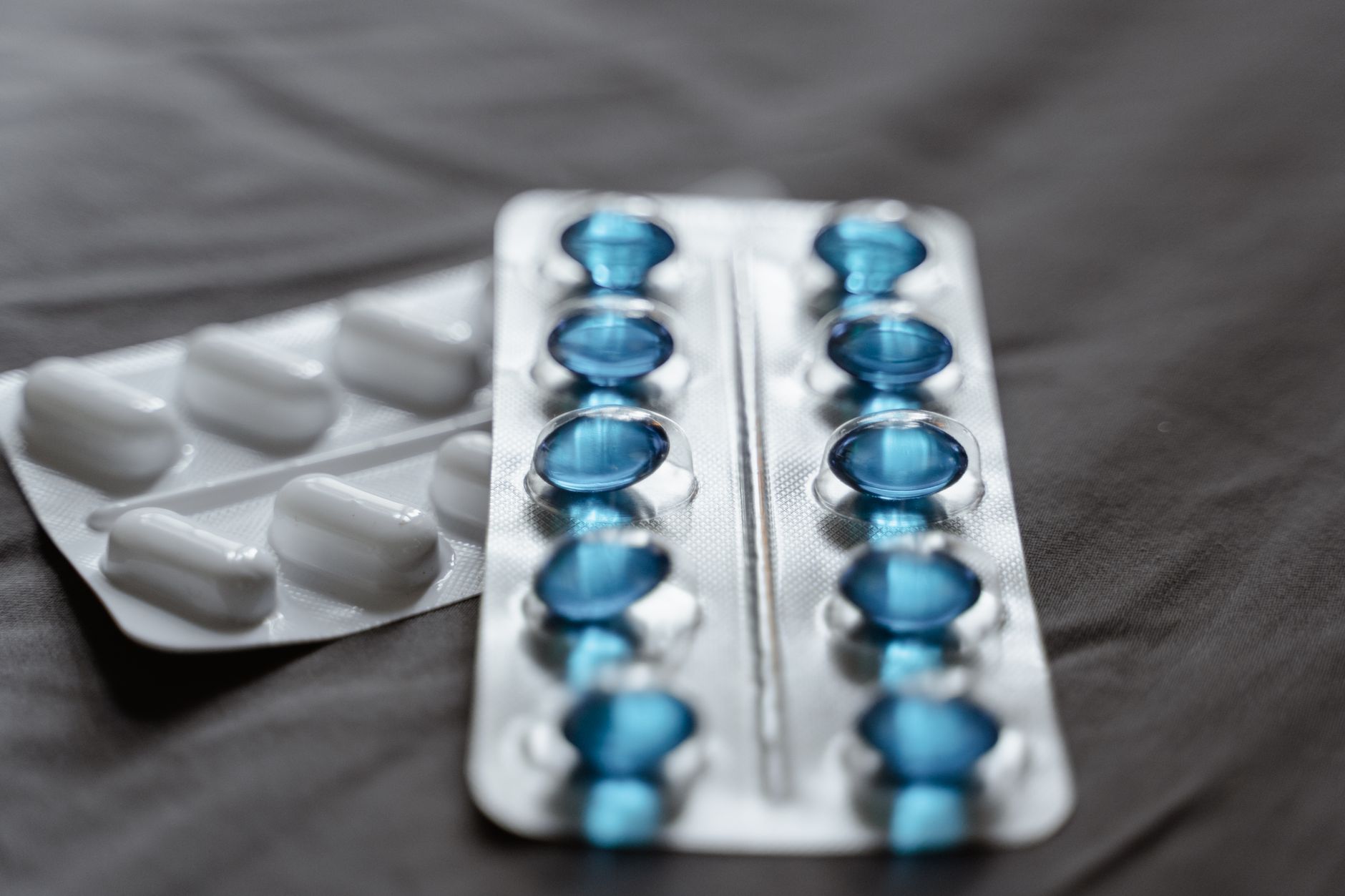 Close-up of compounded medication capsules and pharmaceutical preparation tools