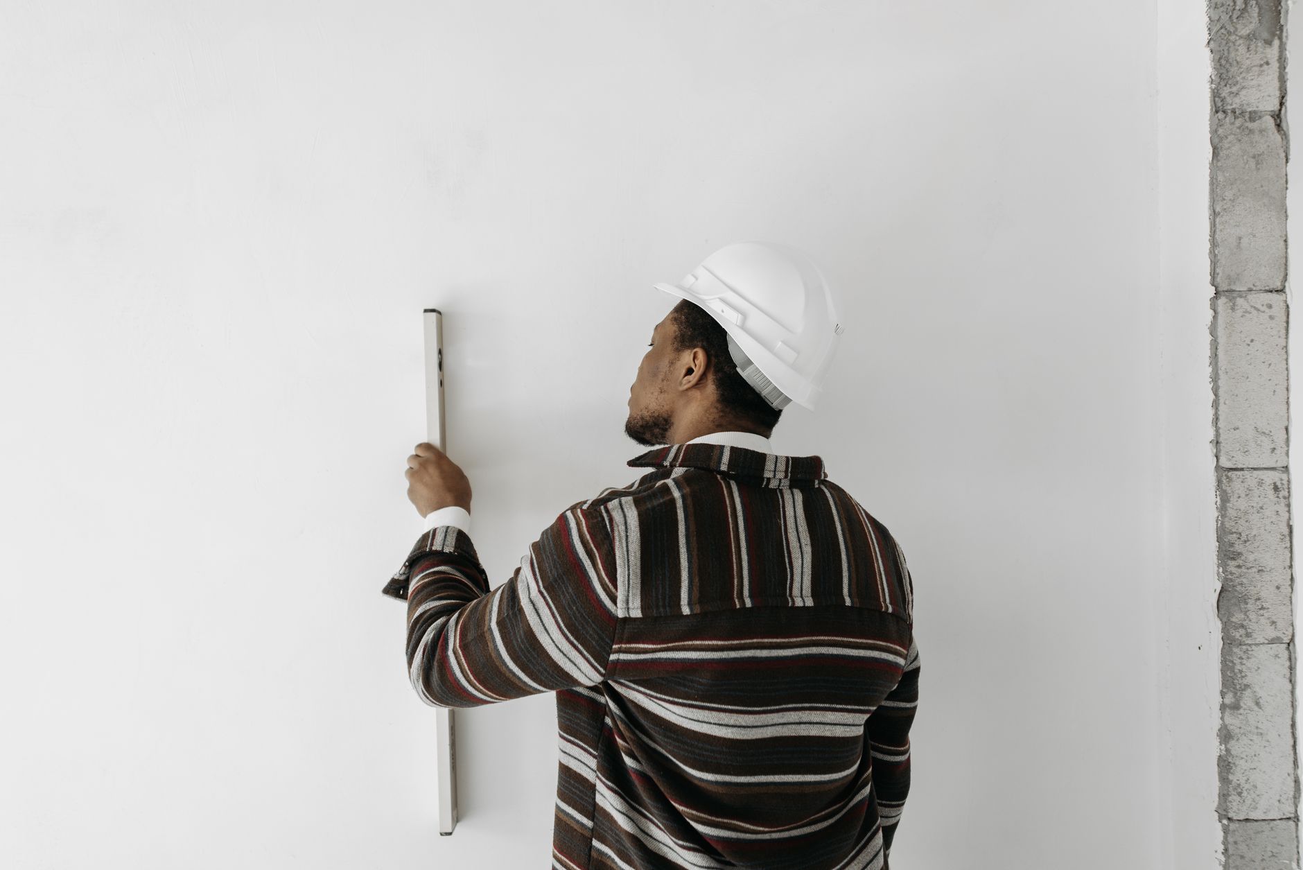Construction contractor reviewing plans at a job site