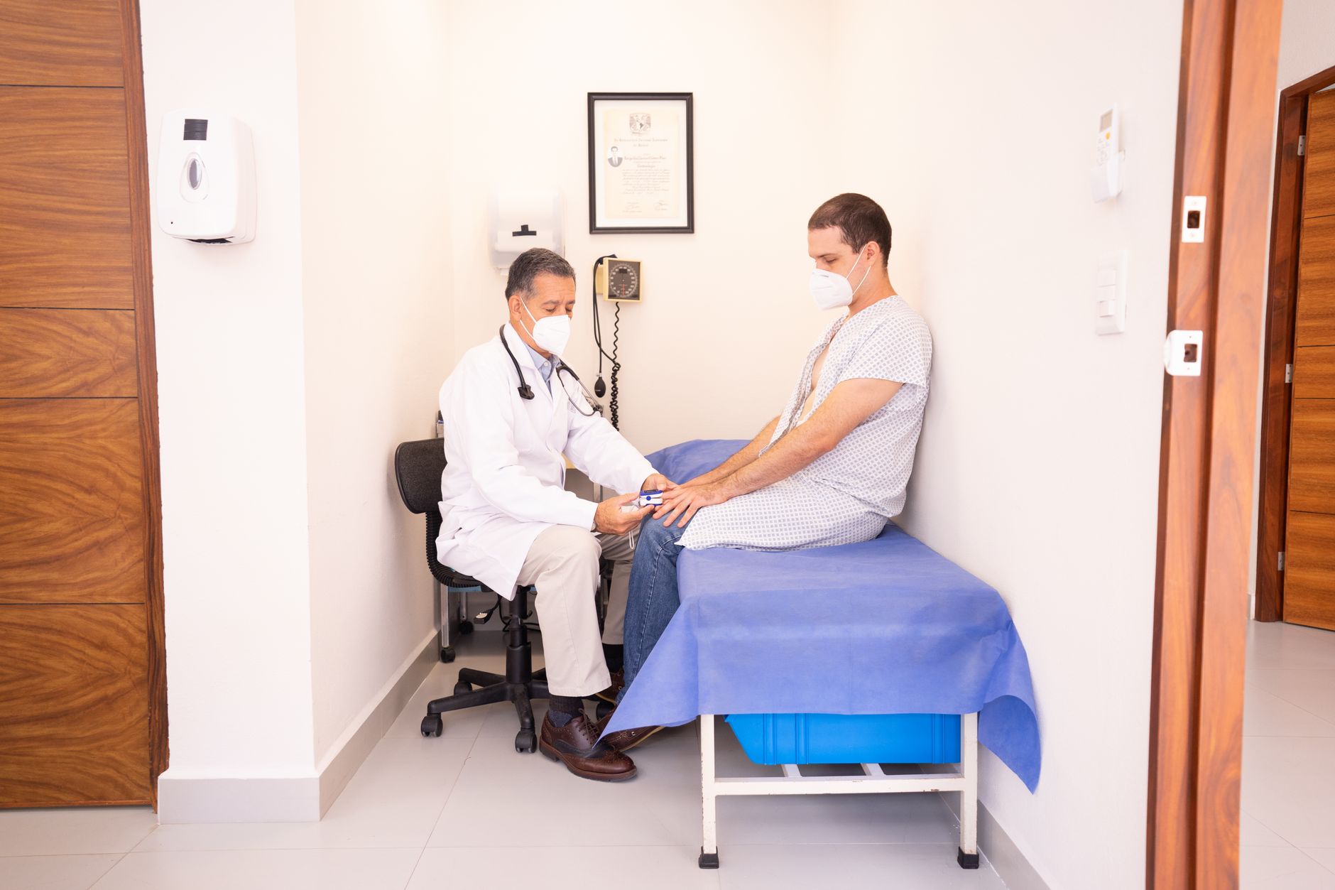 Physician speaking with a patient during a consultation in a private practice office